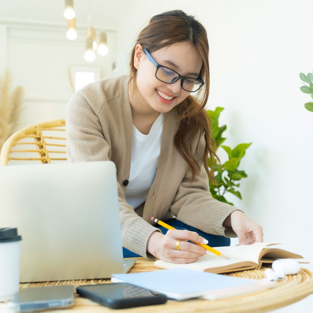 Woman smiling and studying